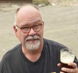 Old Ox Brewery man holding a beer